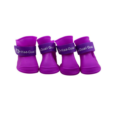 The pet dog boots with four silicone antiskid shoes wear waterproof shoes candy colored pet rainy days appear essential